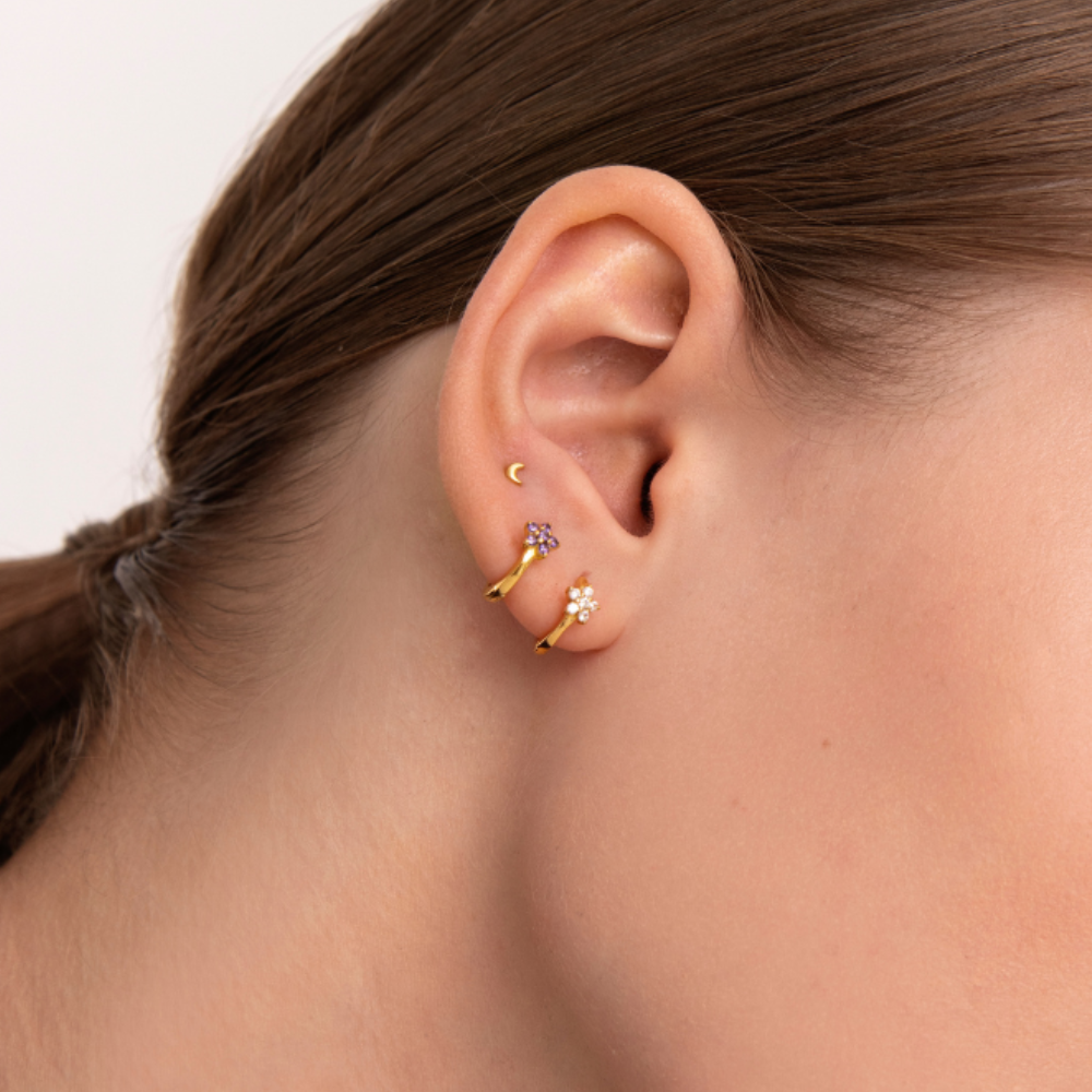 Women's Earring Showcasing an Embedded Star Design and Circular Stone Setting