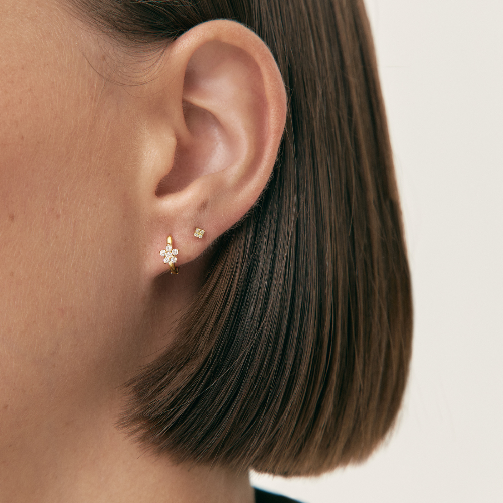 Women's Earring Showcasing an Embedded Star Design and Circular Stone Setting