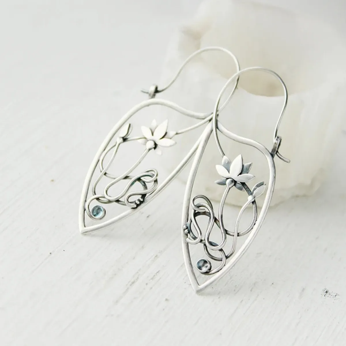 Women's Drop Earrings Showcasing Lotus Flower and Leaf-Inspired Frame with Stylish Line Design