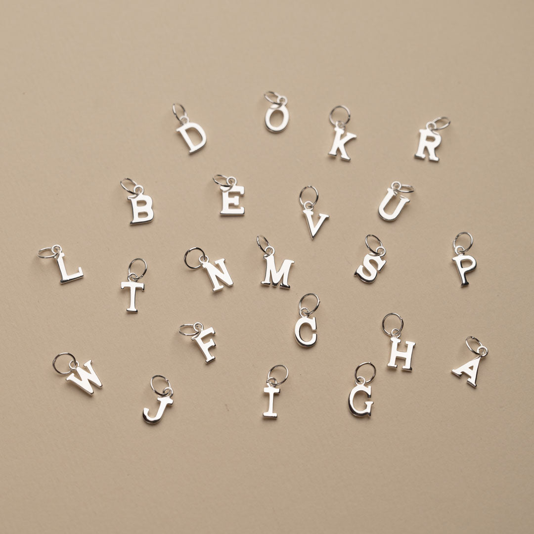 Nadia - Silver letter pendant