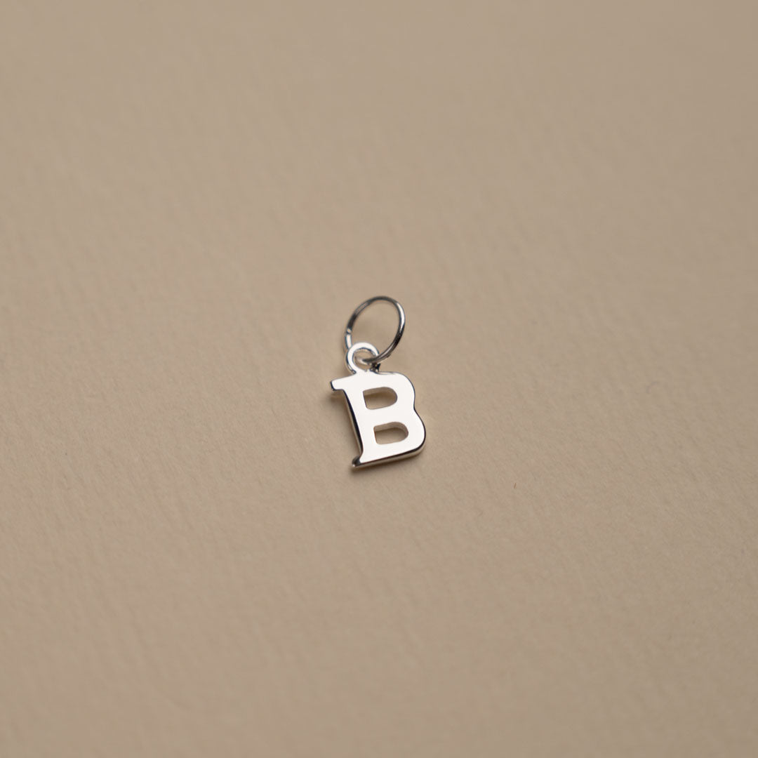 Nadia - Silver letter pendant