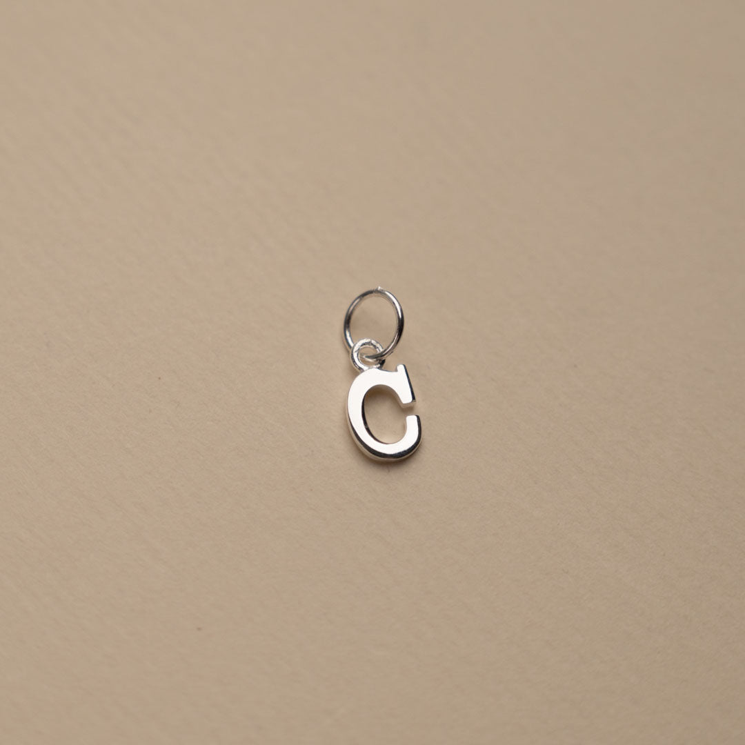 Nadia - Silver letter pendant