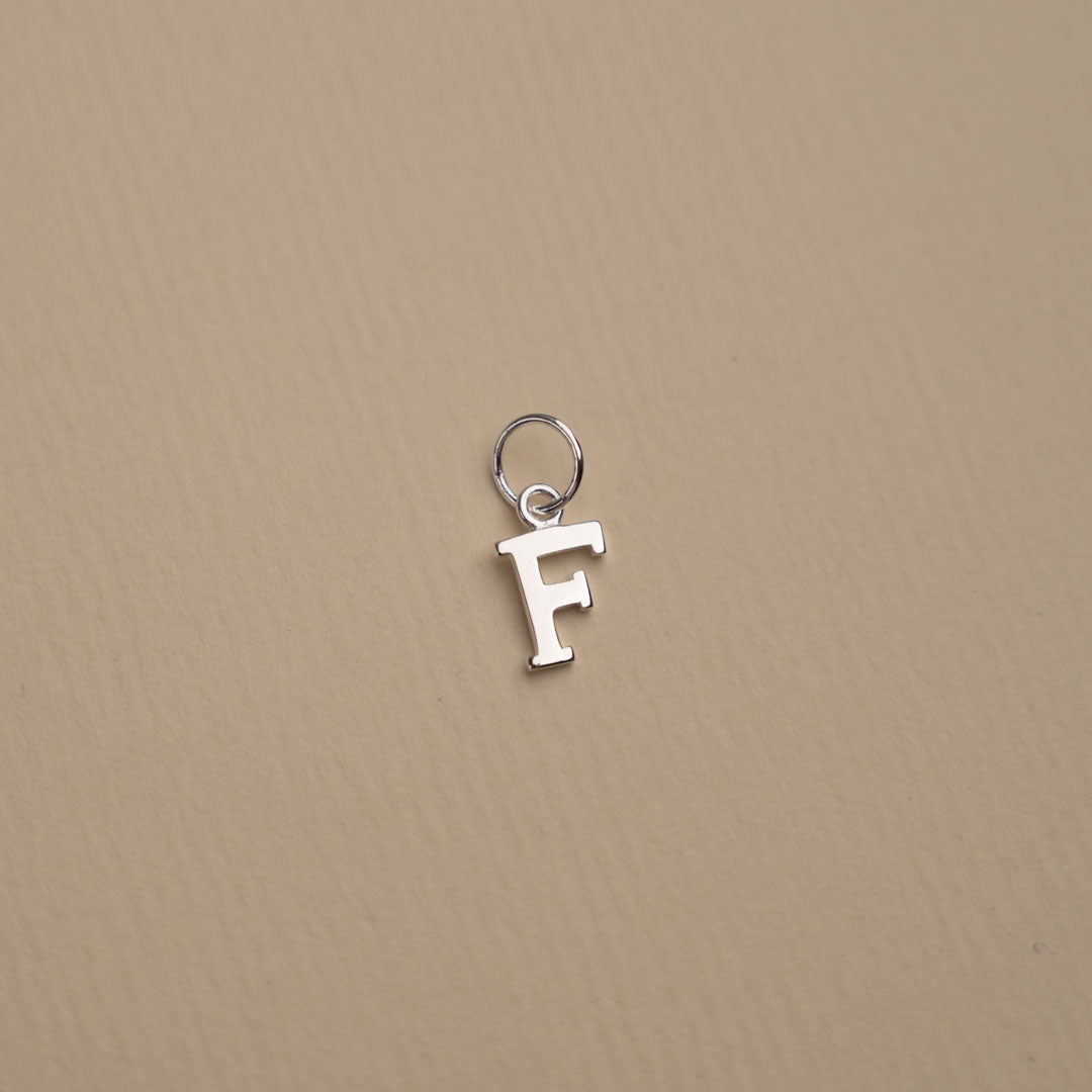 Nadia - Silver letter pendant