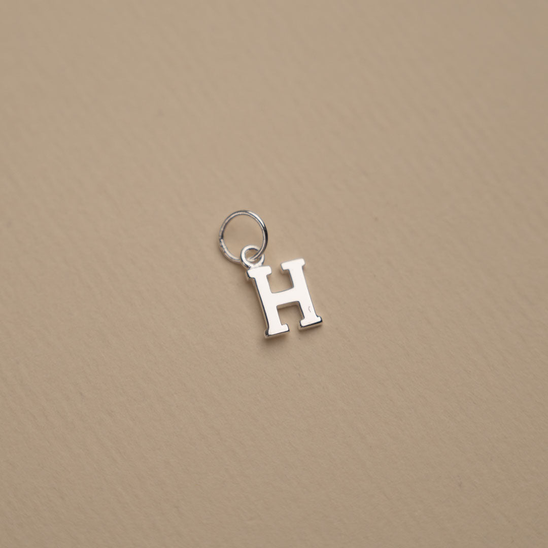 Nadia - Silver letter pendant