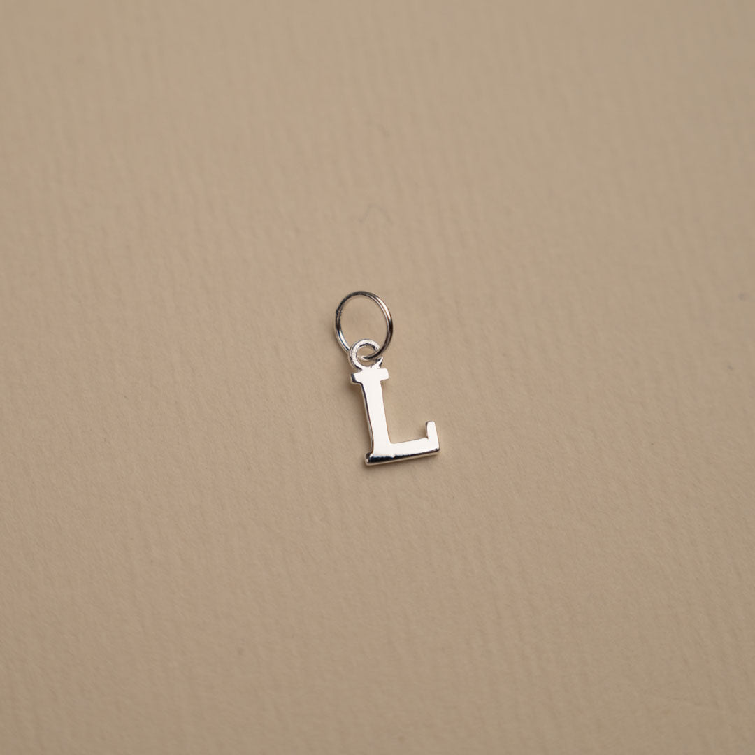 Nadia - Silver letter pendant